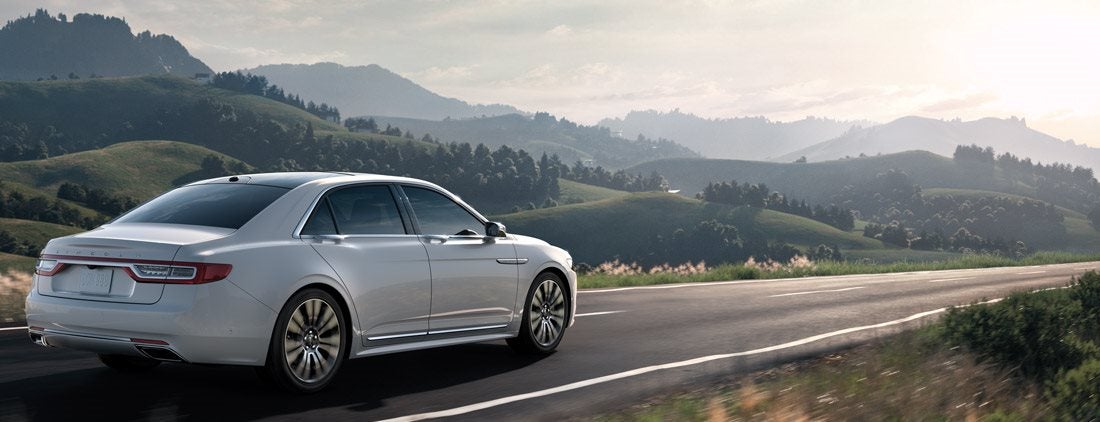 White Continental driving in the country 2017 Lincoln Continental